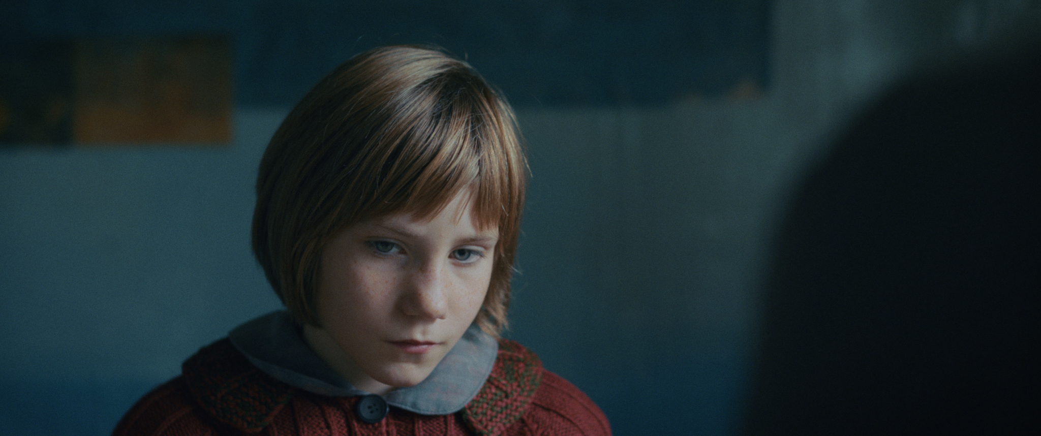 Child's face, staring into nothingness