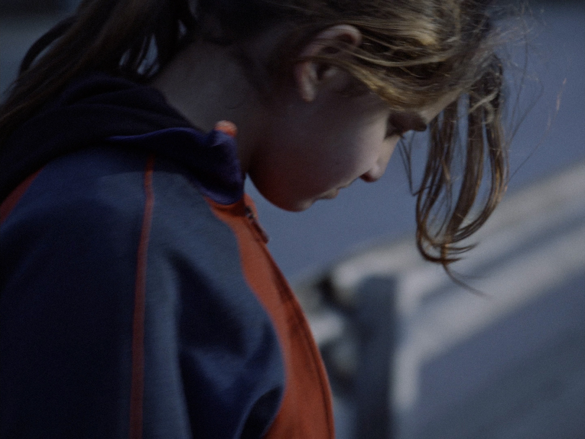 Young girl looking away and downwards