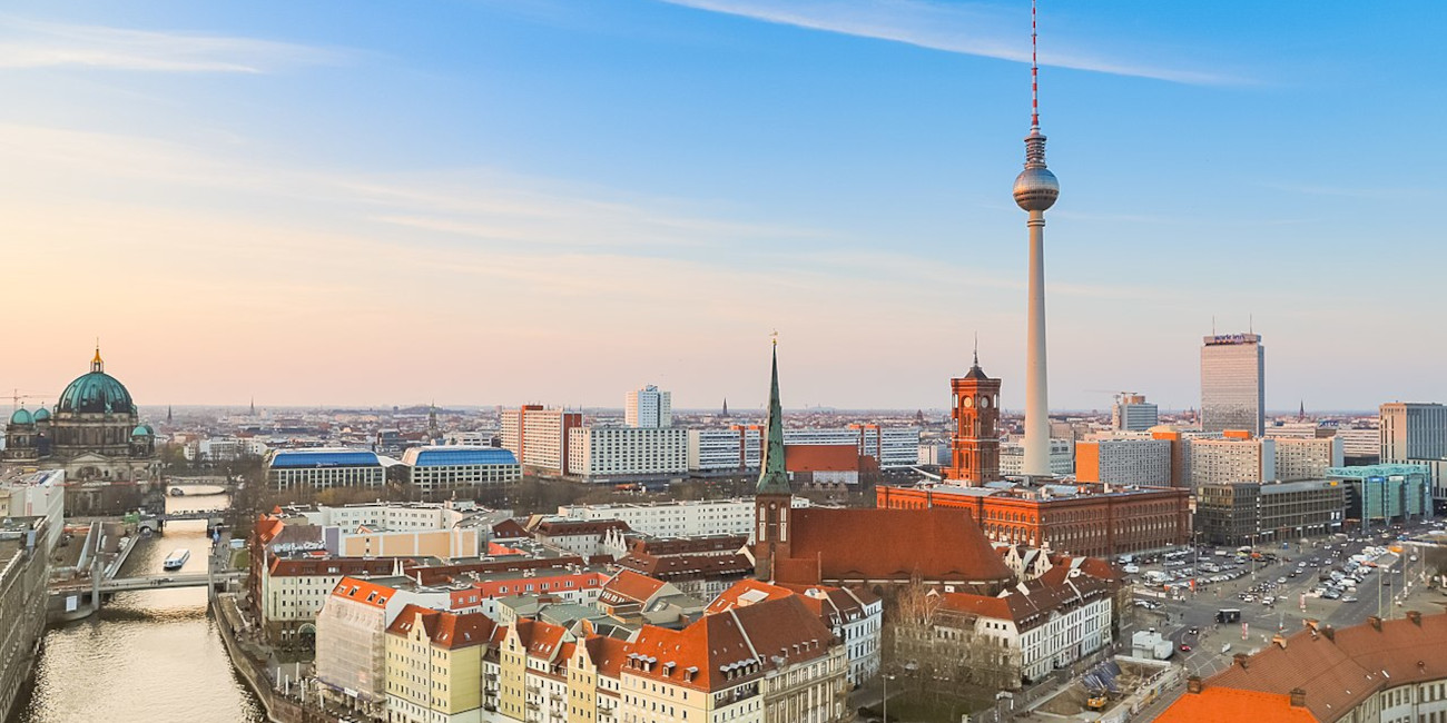 photo of Berlin skyline with tv tower and red townhall