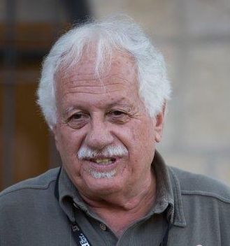portrait of a white-haired man with mustache