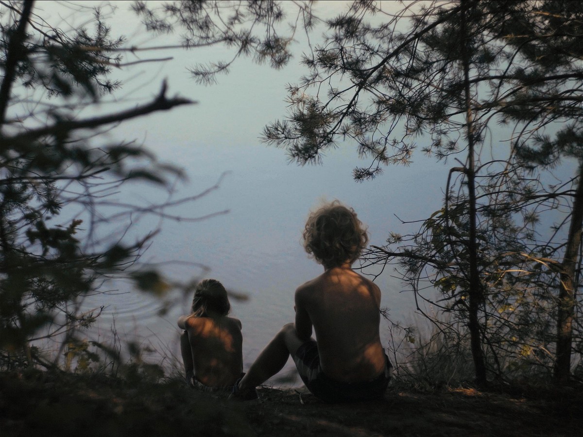 still of two kids with water in the background