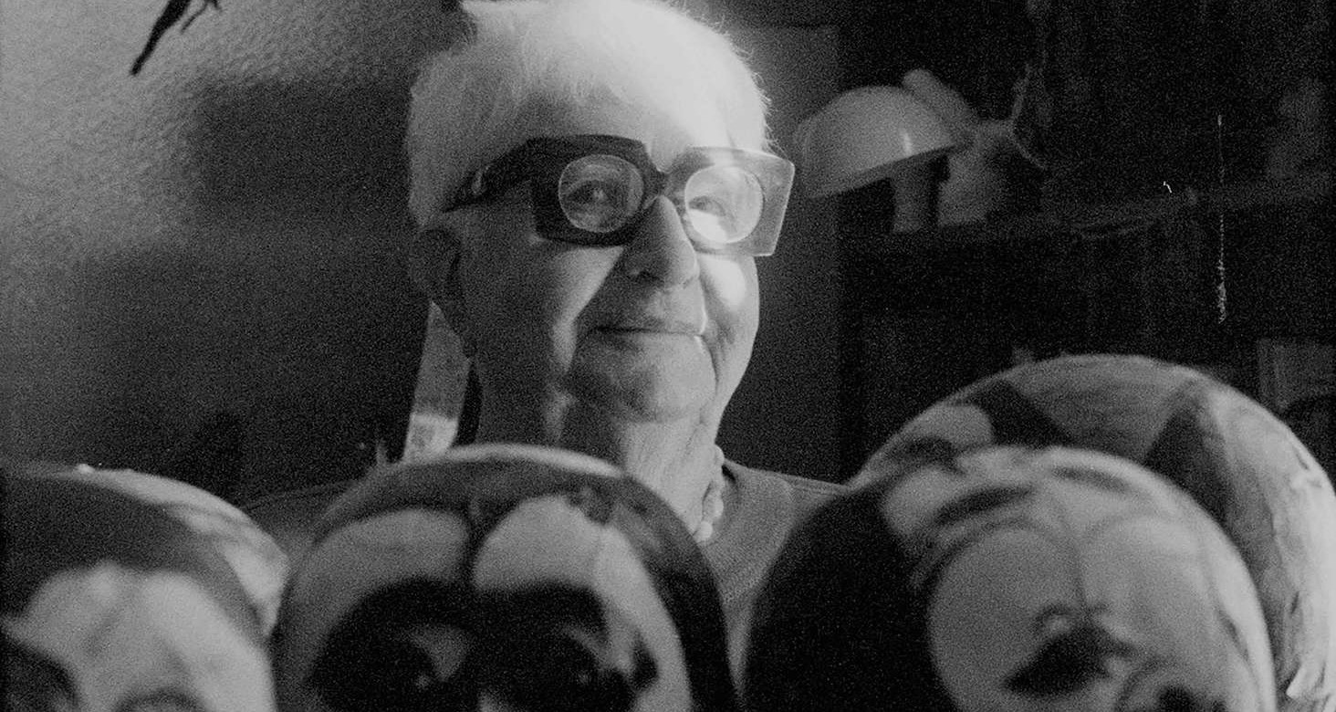 B&W film still of bespectacled person